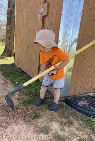 Child helping with yard work