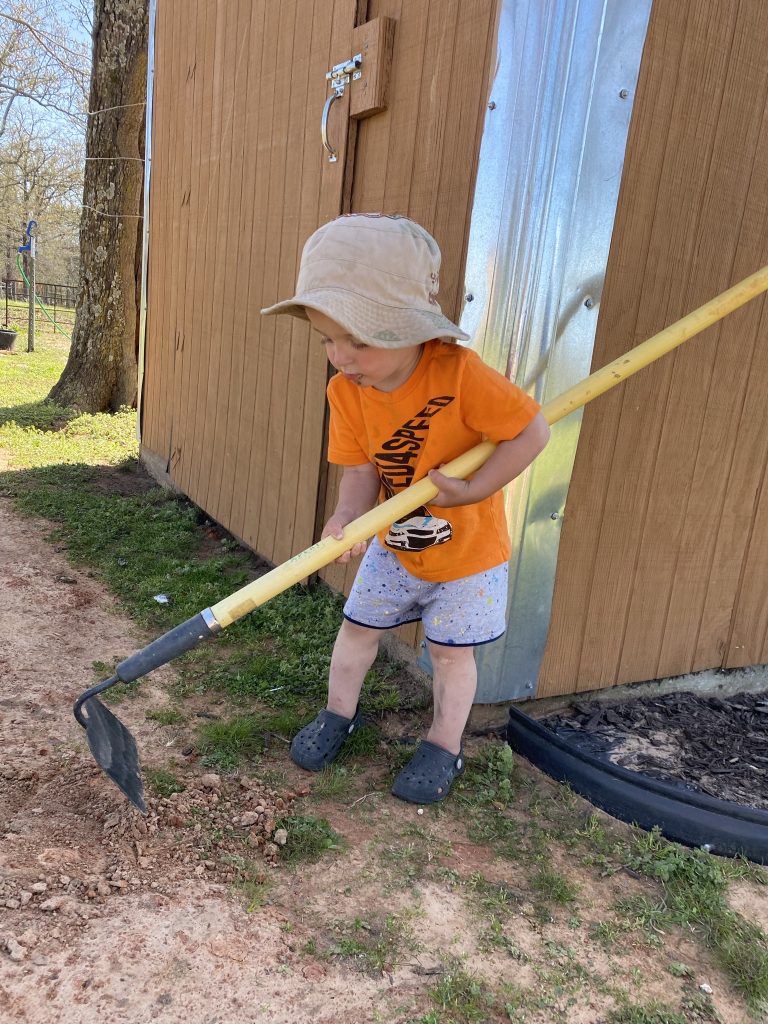 Child helping with yard work